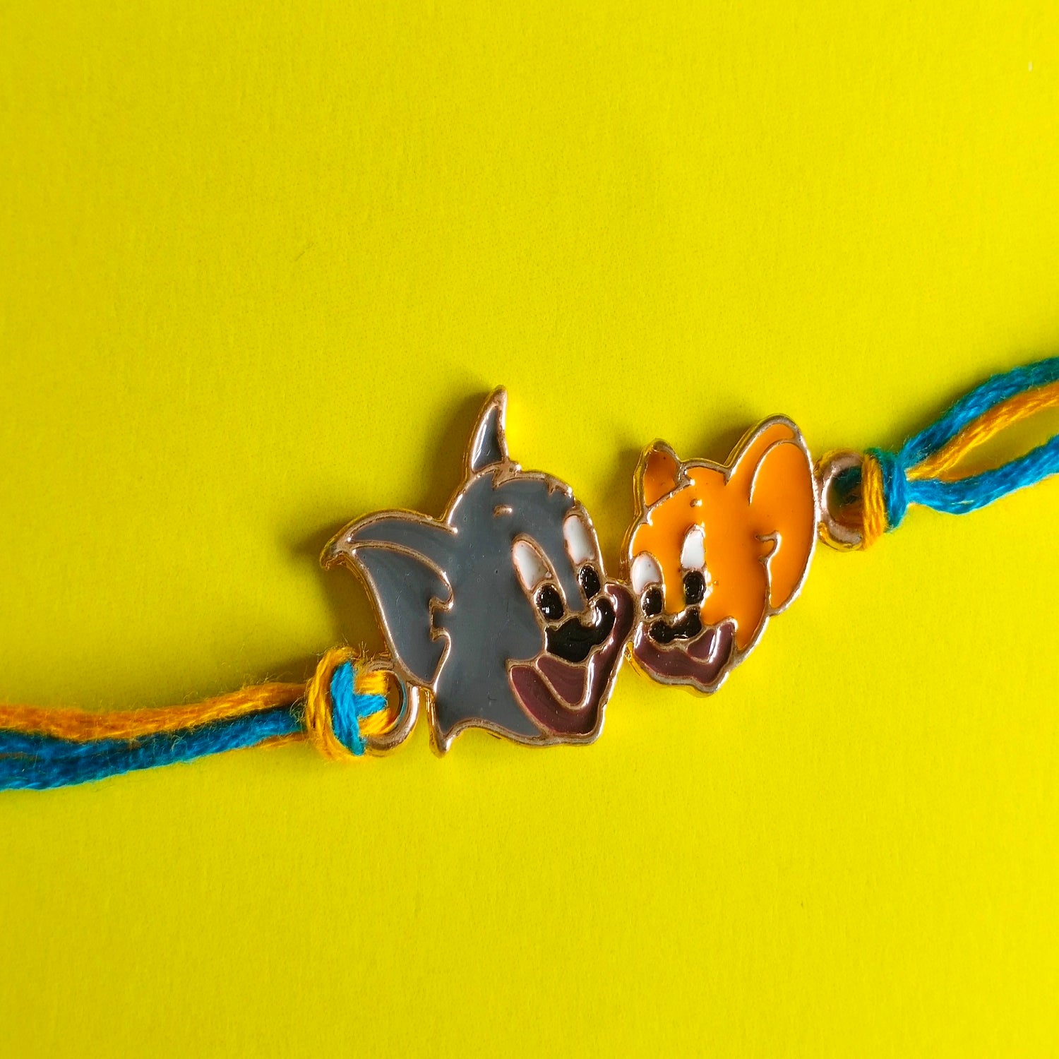 Rose Gold Plated Cartoon Rakhi for Kids with Meena Work