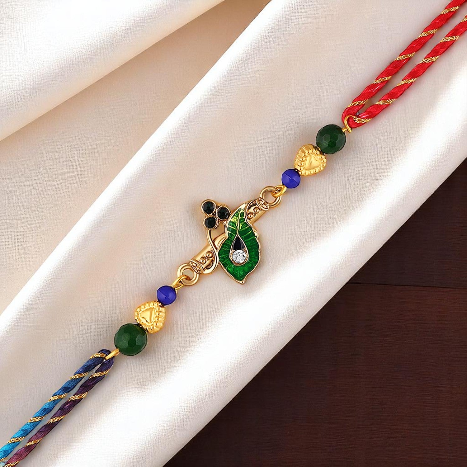 Krishna Flute, Meena Work Peacock Feather-Shaped Rakhi