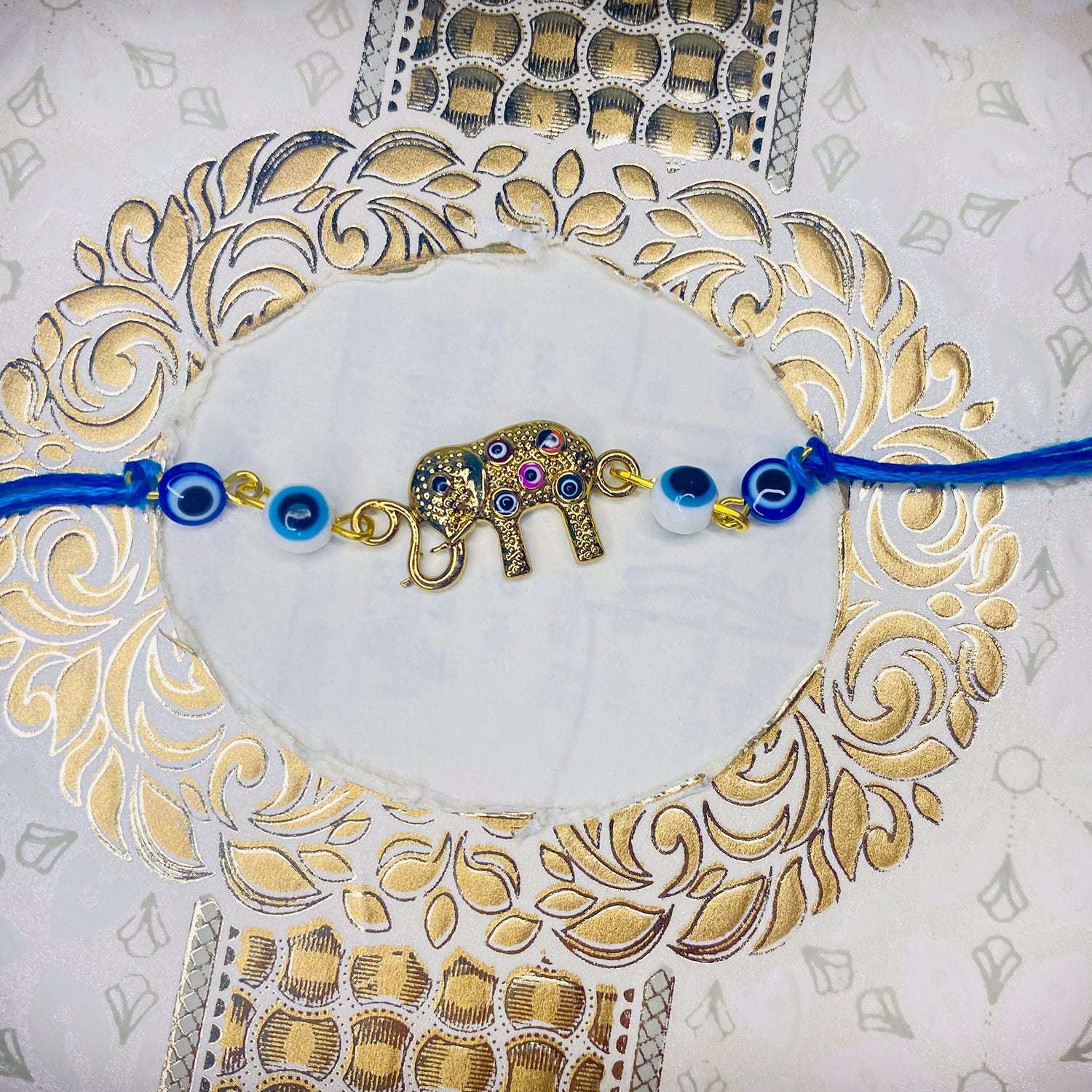 Evil Eye and Baby Elephant-Shaped Rakhi
