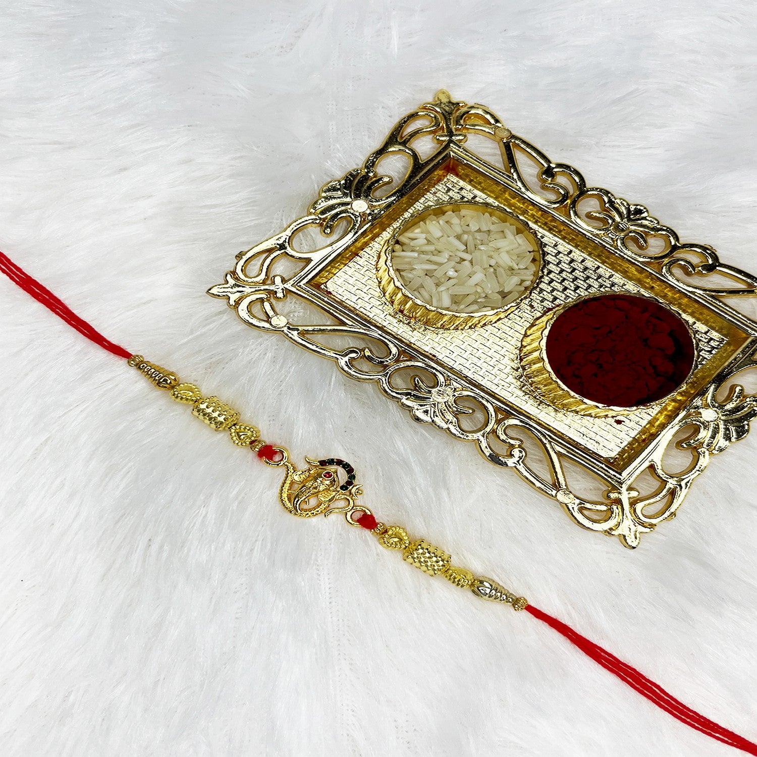 Vighnaharta Ganpati Studded Rakhi