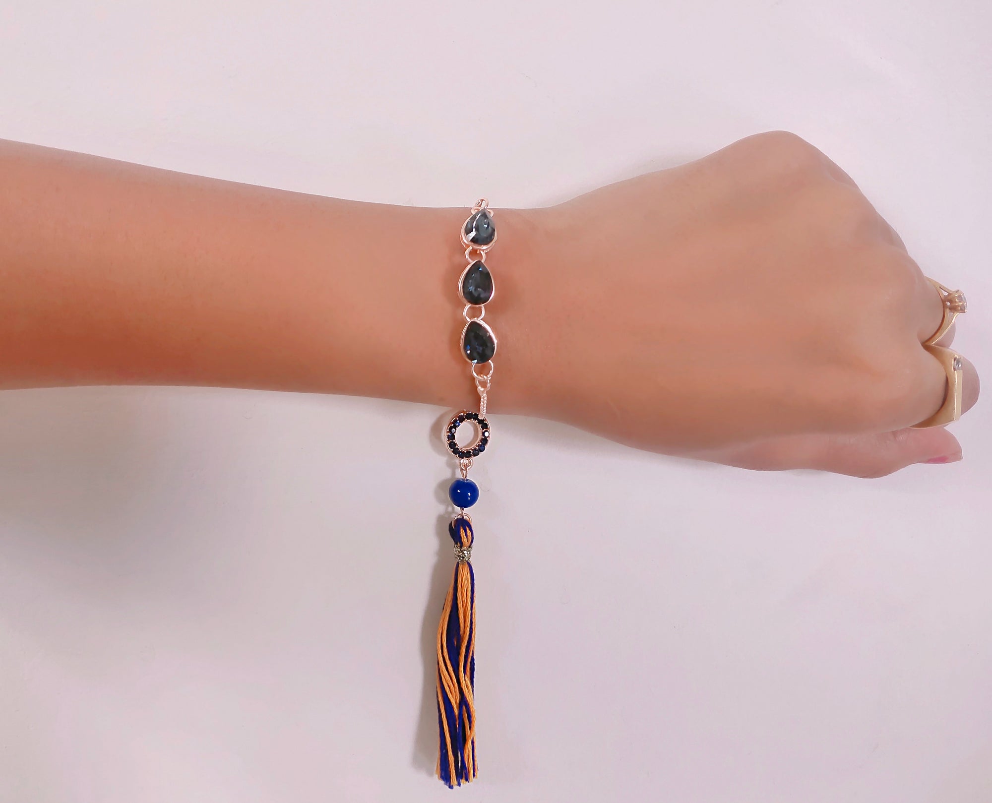 Water Drop Shape Monatana Blue Lumba Rakhi with Tassel