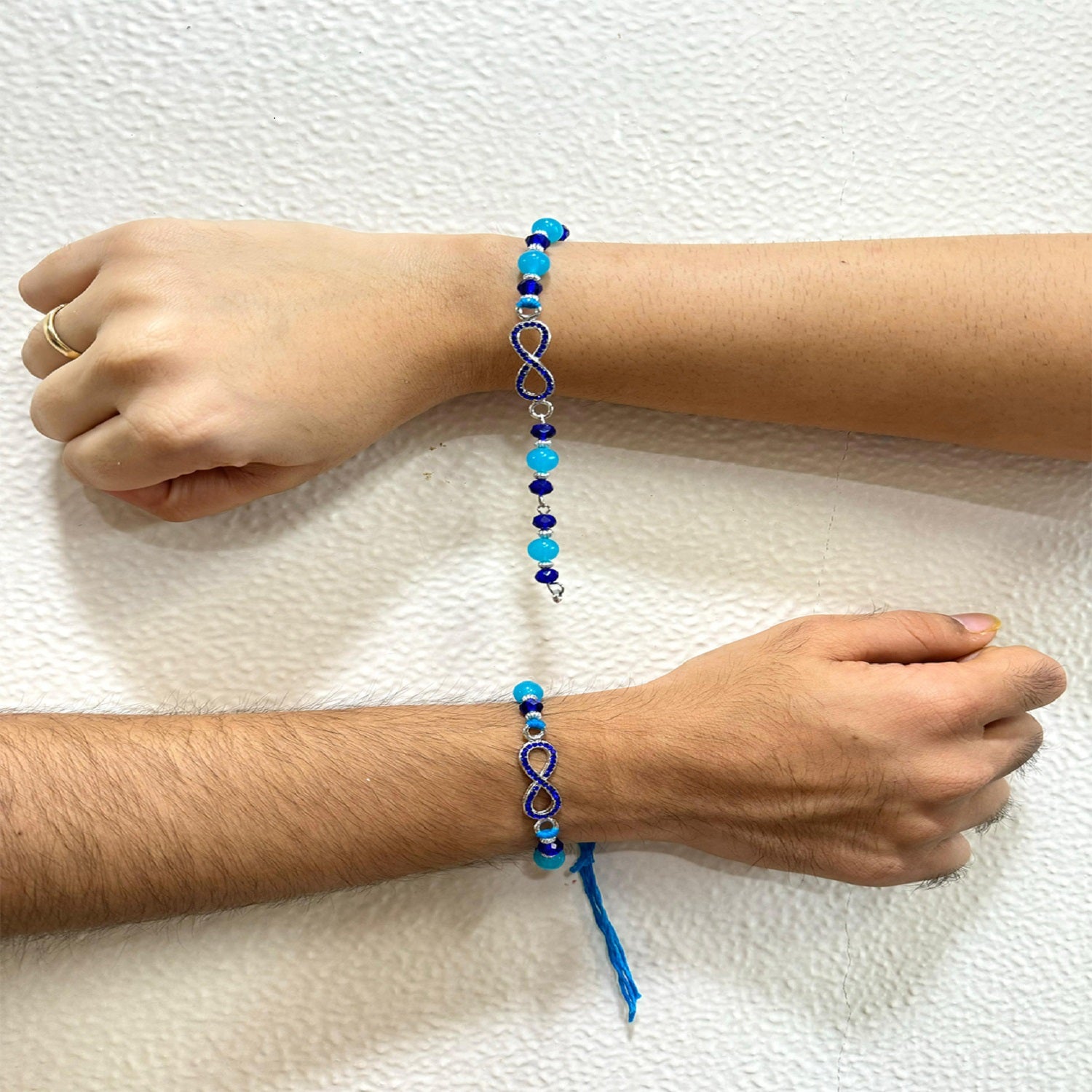 Infinity Shape Blue Crystal Studed Couple Rakhi