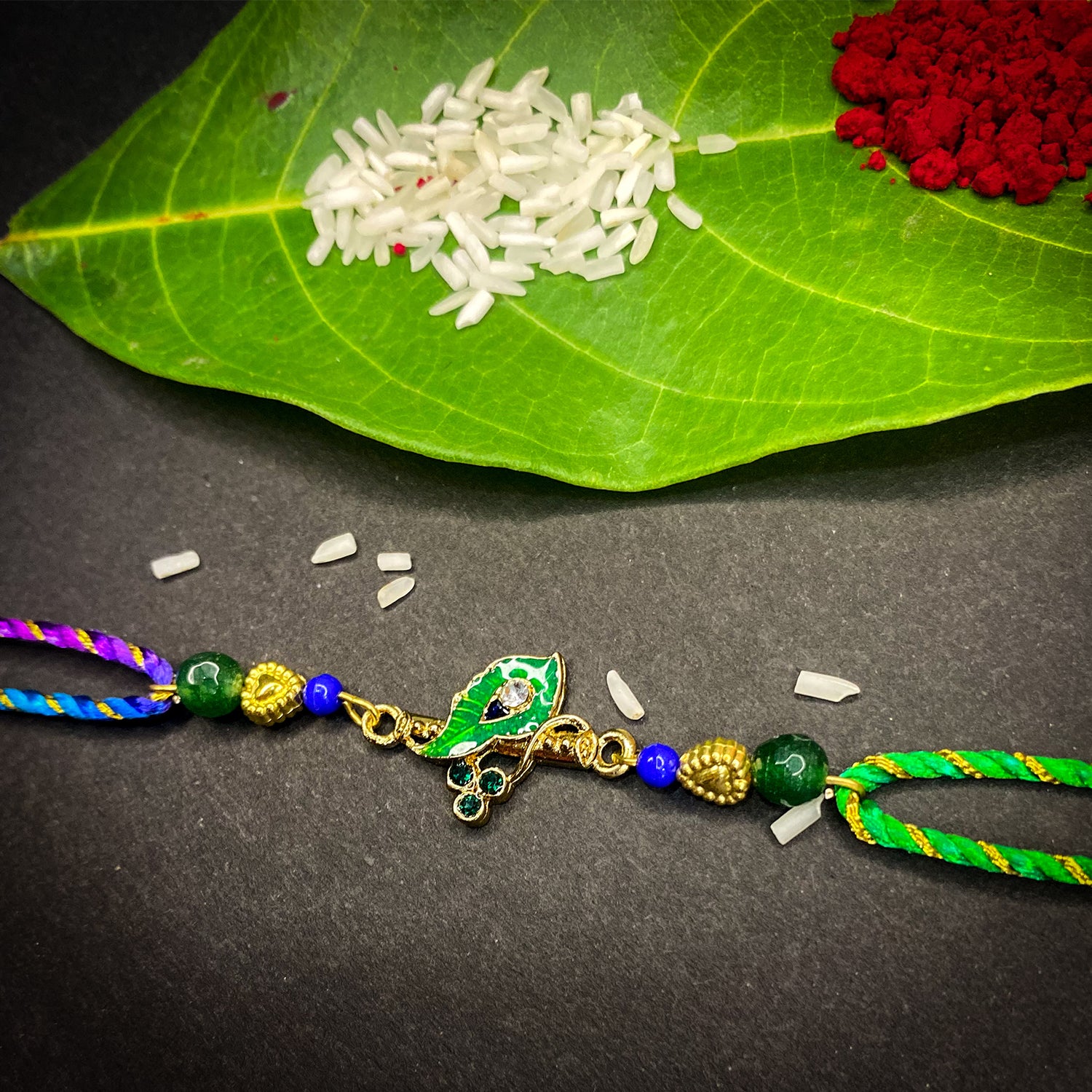 Krishna Flute, Meena Work Peacock Feather-Shaped Rakhi