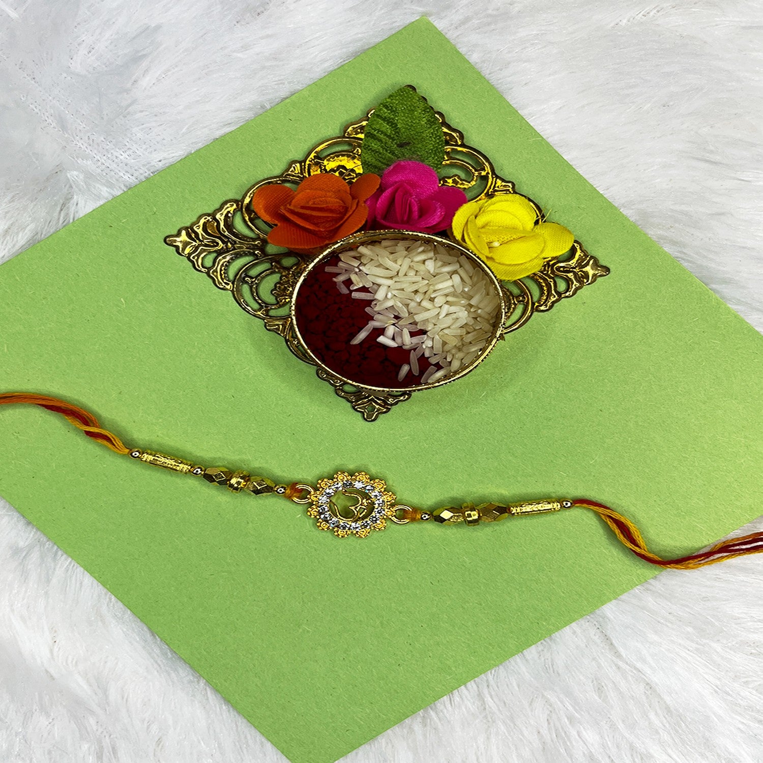 Floral and OM Engraved Studed Rakhi