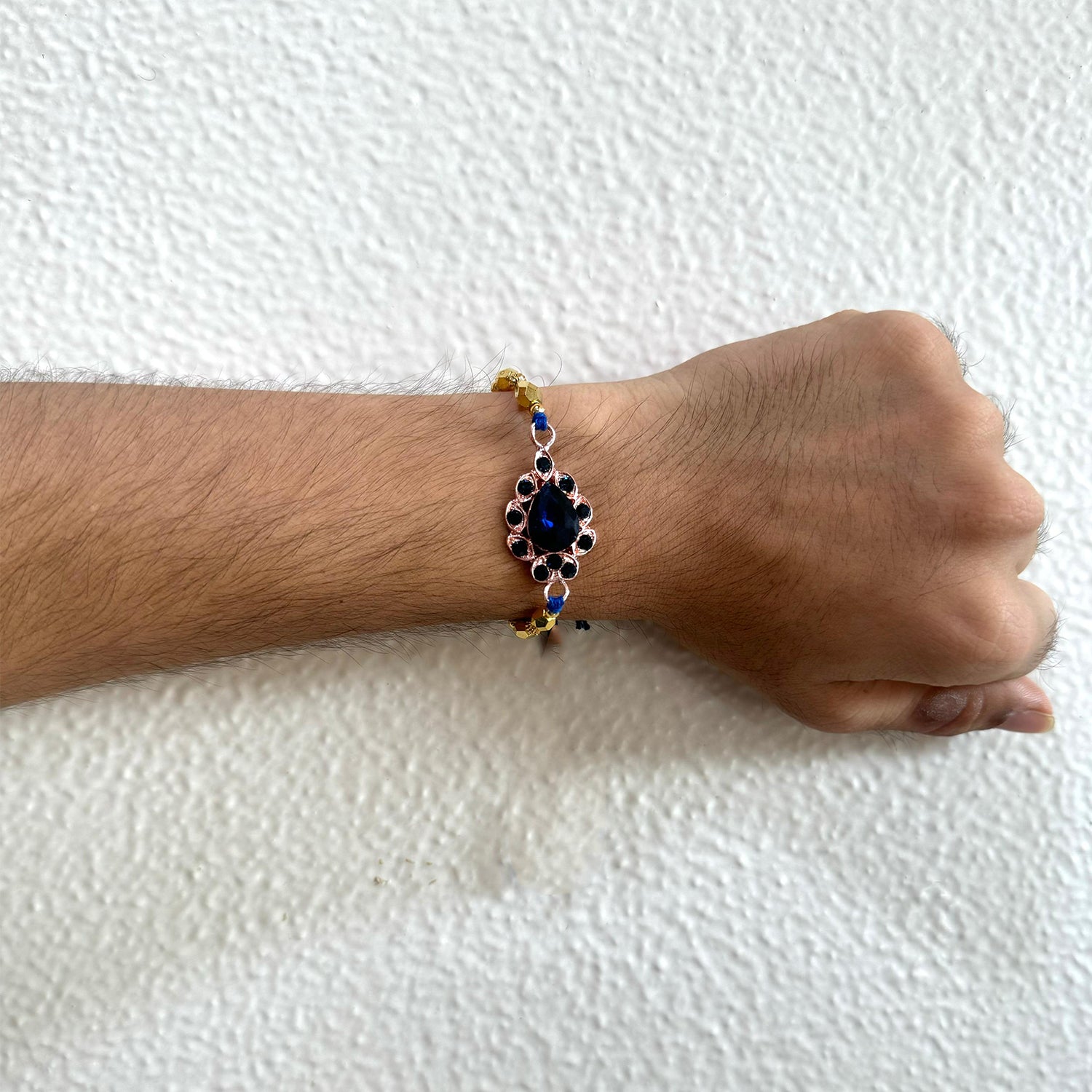 Mahi Rose Gold Plated Blue Crystals Studded Simple and Classic Rakhi for Bhaiya, Brother, Bhai, Bro (RA1100794ZBlu)