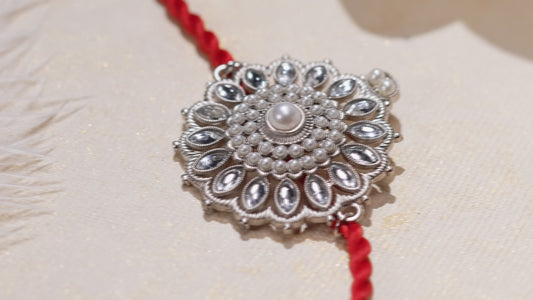 Silver-Toned Motif Floral Rakhi